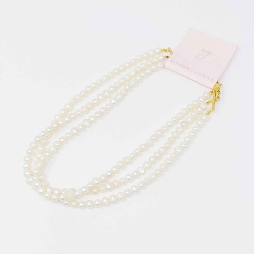 Opulent Pearl Elegance: Triple Strand Necklace