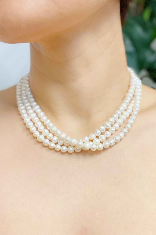 Opulent Pearl Elegance: Triple Strand Necklace