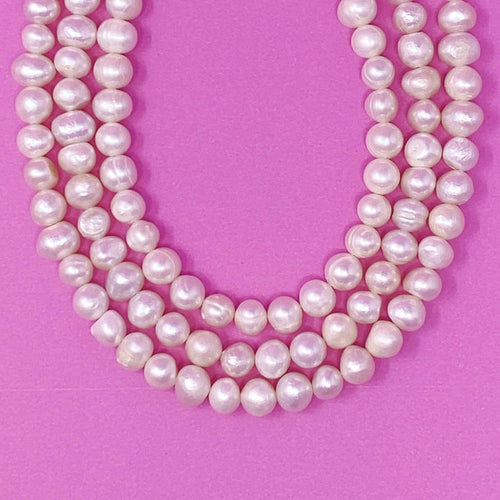 Opulent Pearl Elegance: Triple Strand Necklace