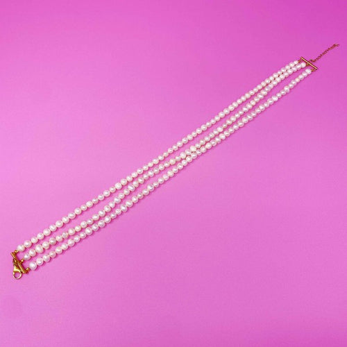 Opulent Pearl Elegance: Triple Strand Necklace