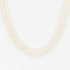 Opulent Pearl Elegance: Triple Strand Necklace