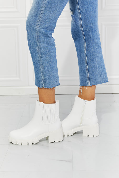 Prime Luxury: White Faux Patent Leather Boots