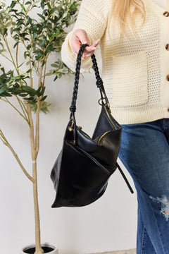 The Braided Strap Shoulder Bag: An Elegantly Functional Masterpiece