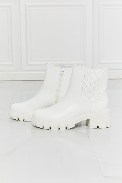 Prime Luxury: White Faux Patent Leather Boots