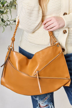 The Braided Strap Shoulder Bag: An Elegantly Functional Masterpiece