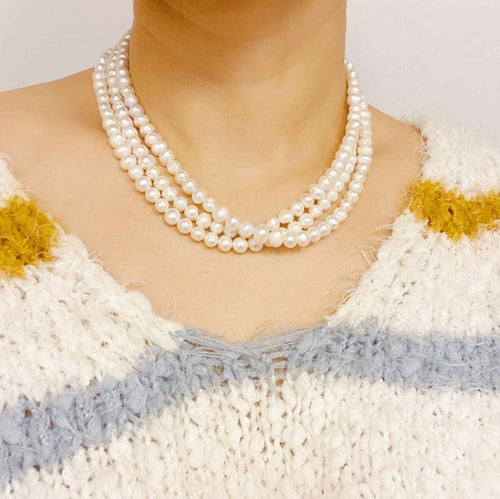 Opulent Pearl Elegance: Triple Strand Necklace