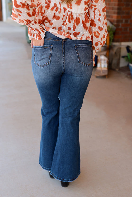 Blue Distressed Flare Jeans: '70s Retro Revival!