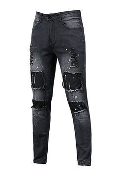 Modern man's ripped slim jeans exude confidence.